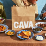 cava food take away bag with plates on the table