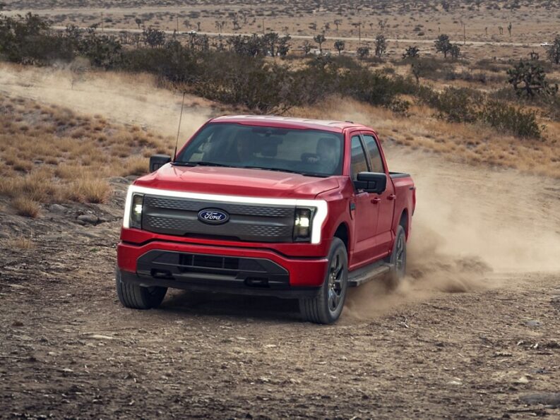 2024 ford lightning truck red colour on dirt road